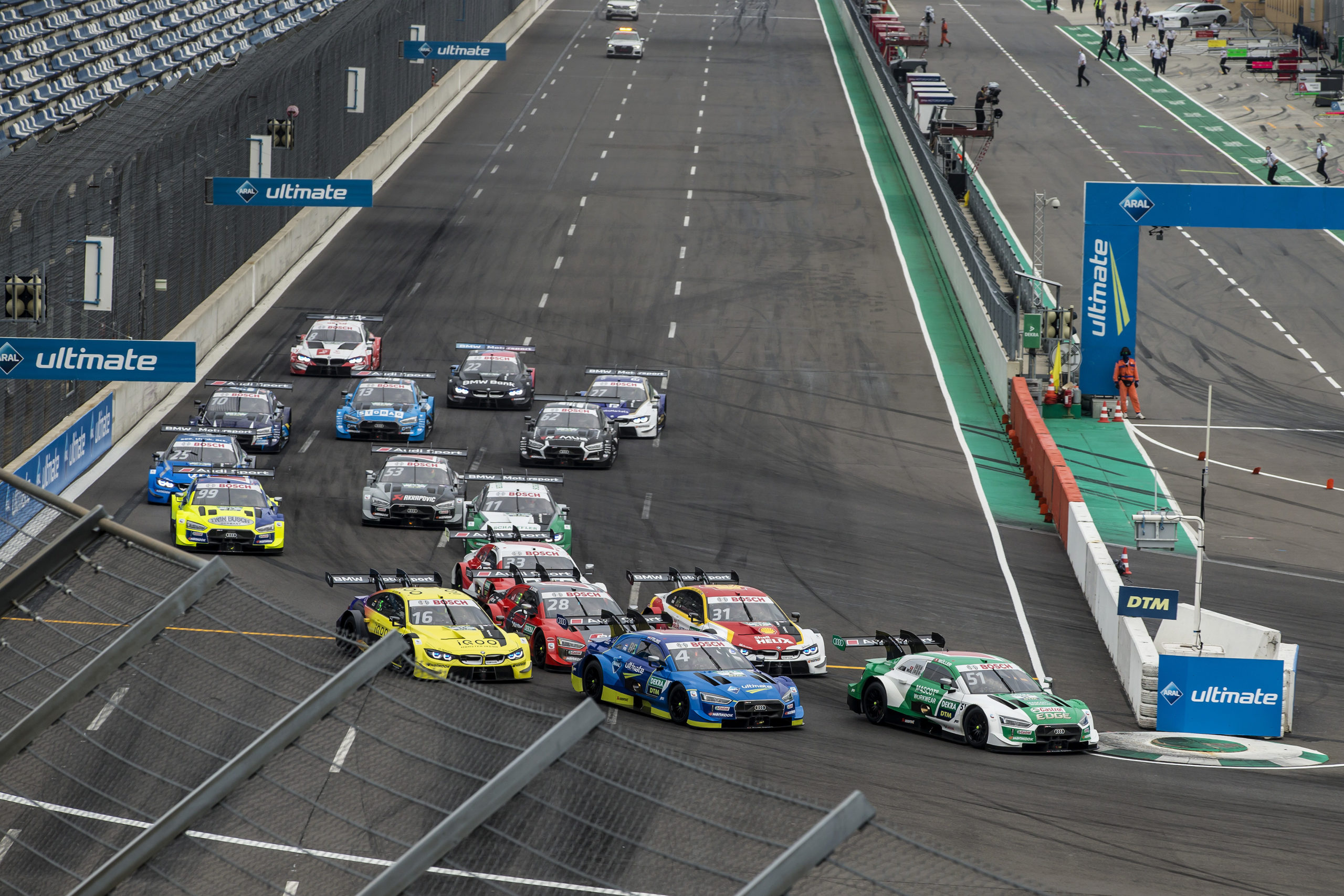 Start of the race, 51 Nico Müller (SUI, Audi Sport Team Abt Sportsline, Audi RS 5 DTM) taking the lead from 4 Robin Frijns (NED, Audi Sport Team Abt Sportsline, Audi RS 5 DTM), 16 Timo Glock (GER, BMW Team RMG, BMW M4 DTM), 28 Loïc Duval (FRA, Audi Sport Team Phoenix, Audi RS 5 DTM), 31 Sheldon van der Linde (RSA, BMW Team RBM, BMW M4 DTM), 2020 DTM Lausitzring
